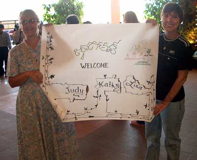 Mary Little and Kathy Tucker hold the welcome sign