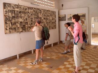 Kathy viewing photos of victims