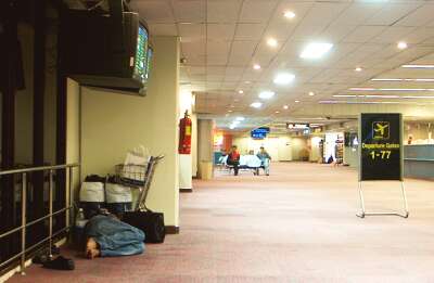 Sleeping on the floor in the Bangkok airport
