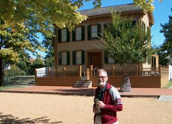 Charlie in front of Lincoln's home