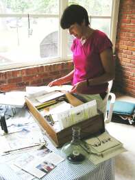 Mary sorting through Mom's papers