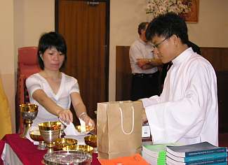 Lucas preparing the chalice for mass