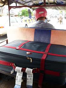 Retrieving my suitcase in a tuk-tuk
