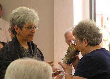 Janet Hockman offering communion