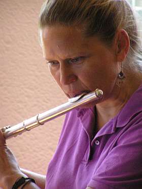Sami Scott playing the flute