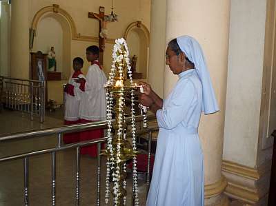 Lighting a ceremonial lamp