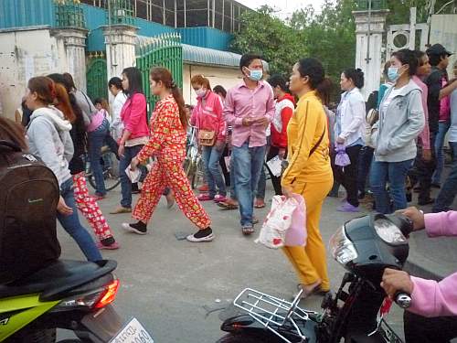 Factory workers at end of a shift