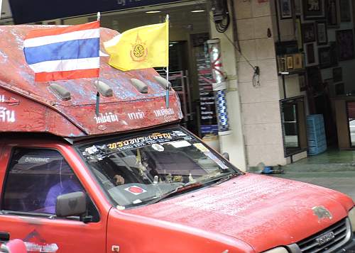 King's flag on a truck taxi