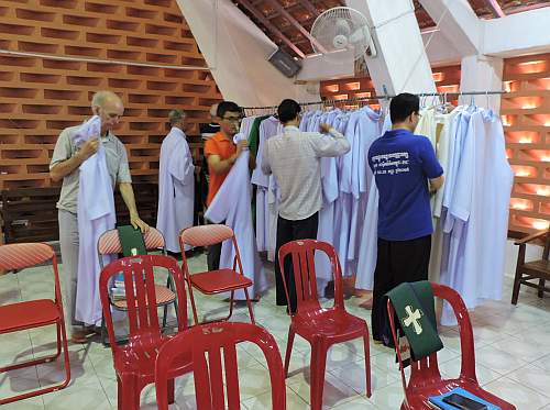 Priests vesting for mass