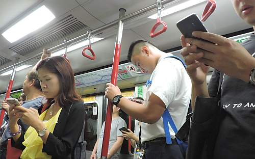 Telephone users on the subway