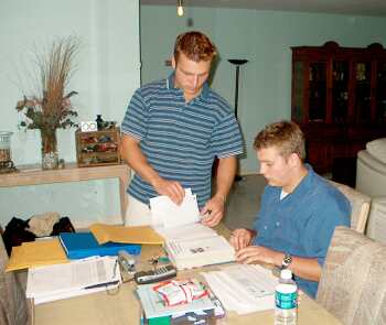 Dalton (seated) studying with his brother Derek