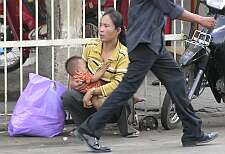 Mother and baby on Phnom Penh street